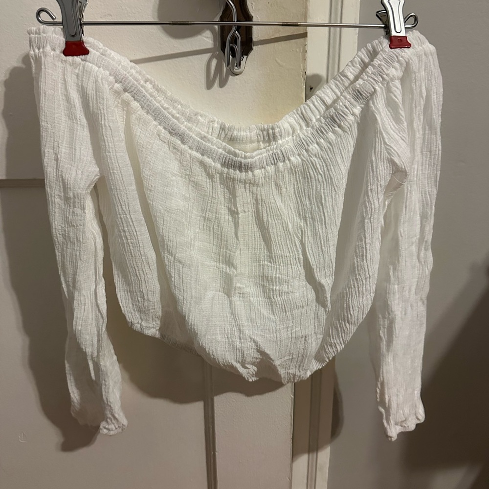 Lulus white flowy pants and off the shoulder sleeve top.